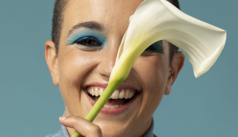 portrait-beautiful-woman-posing-turtleneck-with-flower
